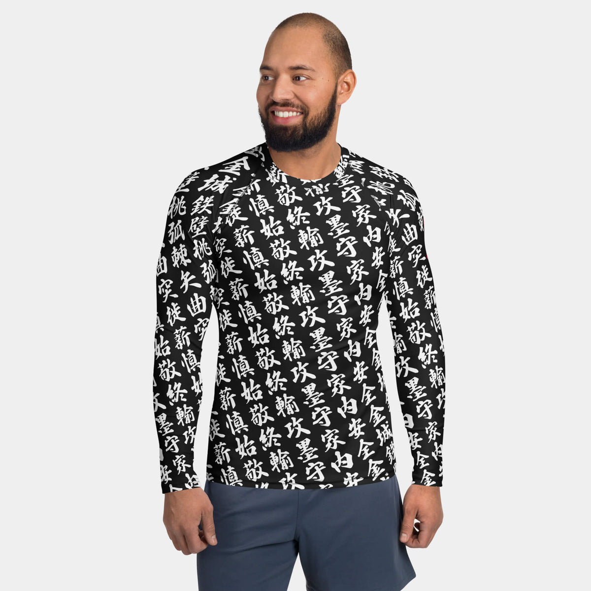 Front view of the men's TOO MUCH KANJI long-sleeve BJJ rash guard in Iron Black and White on a model