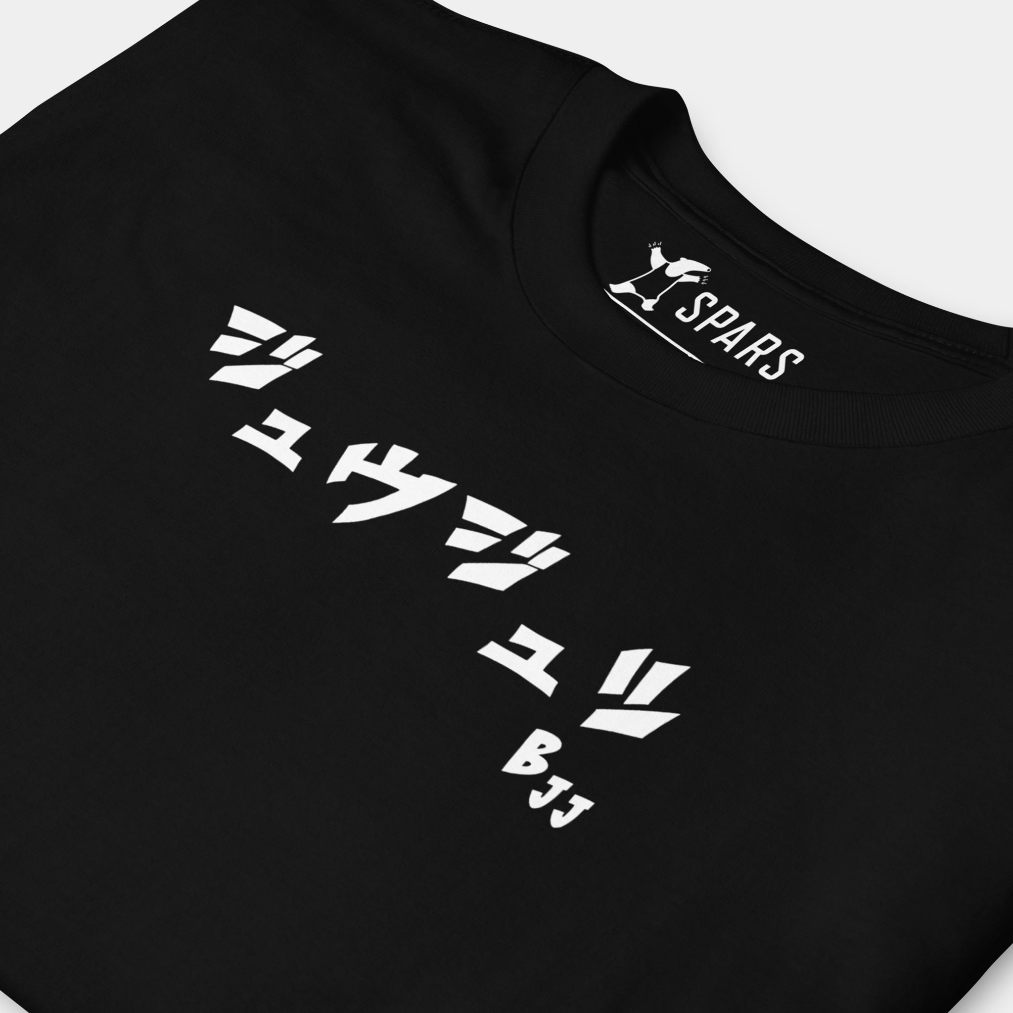 Close-up of the white BJJ katakana chest design on the Men’s BJJ KATAKANA Daily Tee in Black