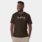 Male model wearing the Men’s BJJ KATAKANA Daily Tee in Dark-Chocolate, front view showing the white chest print.