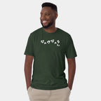 Male model wearing the Men’s BJJ KATAKANA Daily Tee in Forest Green, front view showing the white chest print.