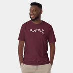 Male model wearing the Men’s BJJ KATAKANA Daily Tee in Maroon, front view showing the white chest print.