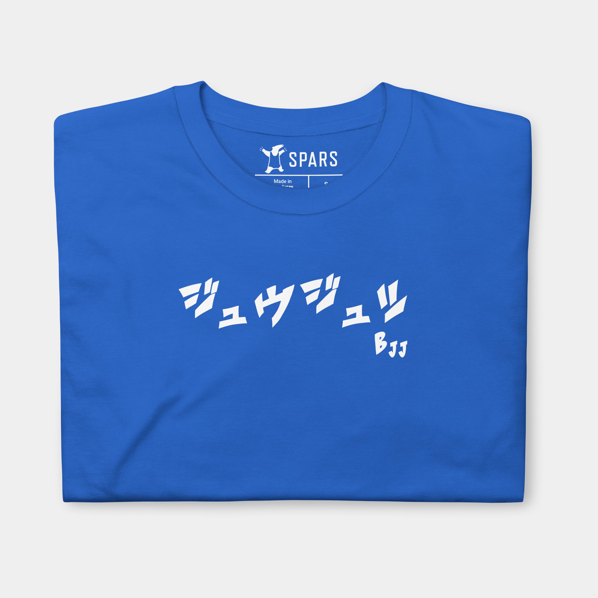 Folded Men’s BJJ KATAKANA Daily Tee in Royal showing the white BJJ katakana chest design