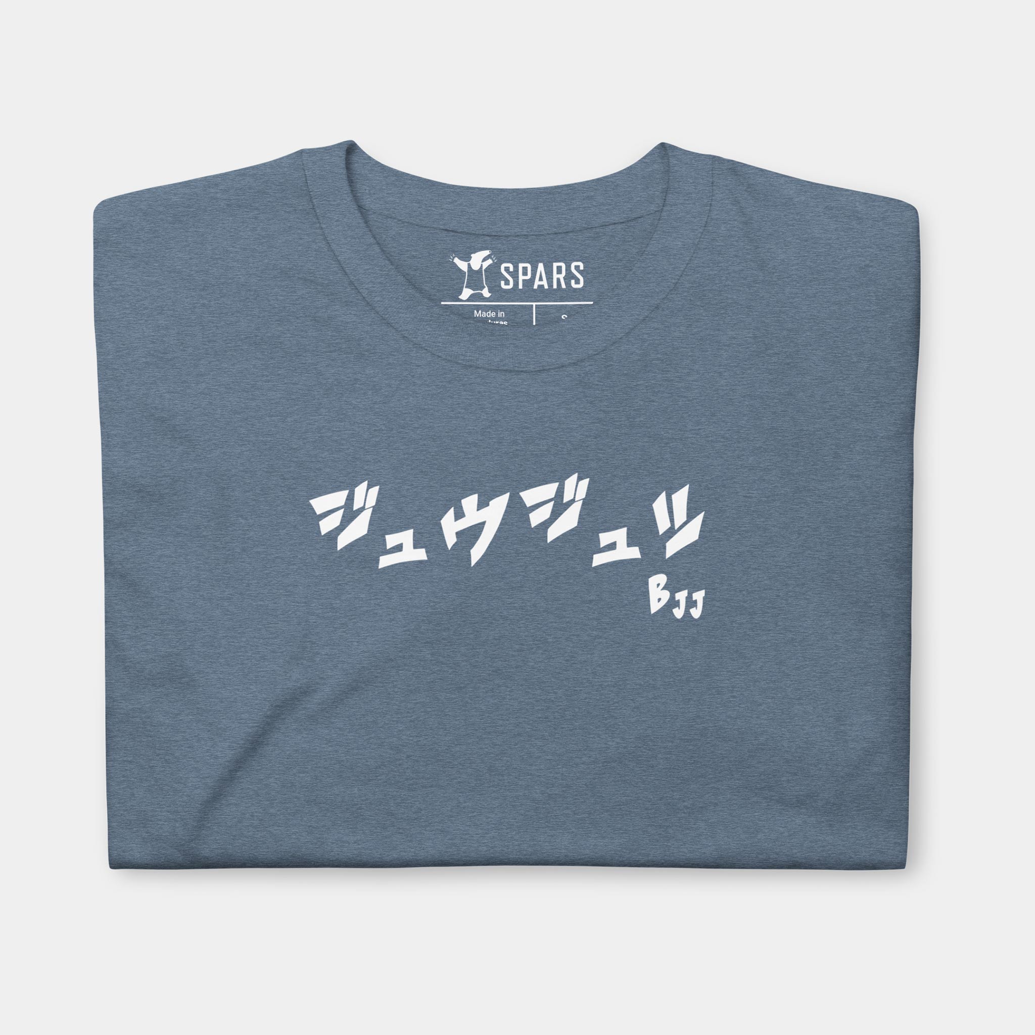 Folded Men’s BJJ KATAKANA Daily Tee in Heather Indigo showing the white BJJ katakana chest design