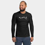 Man wearing the Men’s BJJ KATAKANA Long-Sleeve Rash Guard in Iron Black, full front view showing the off-white katakana and BJJ chest print