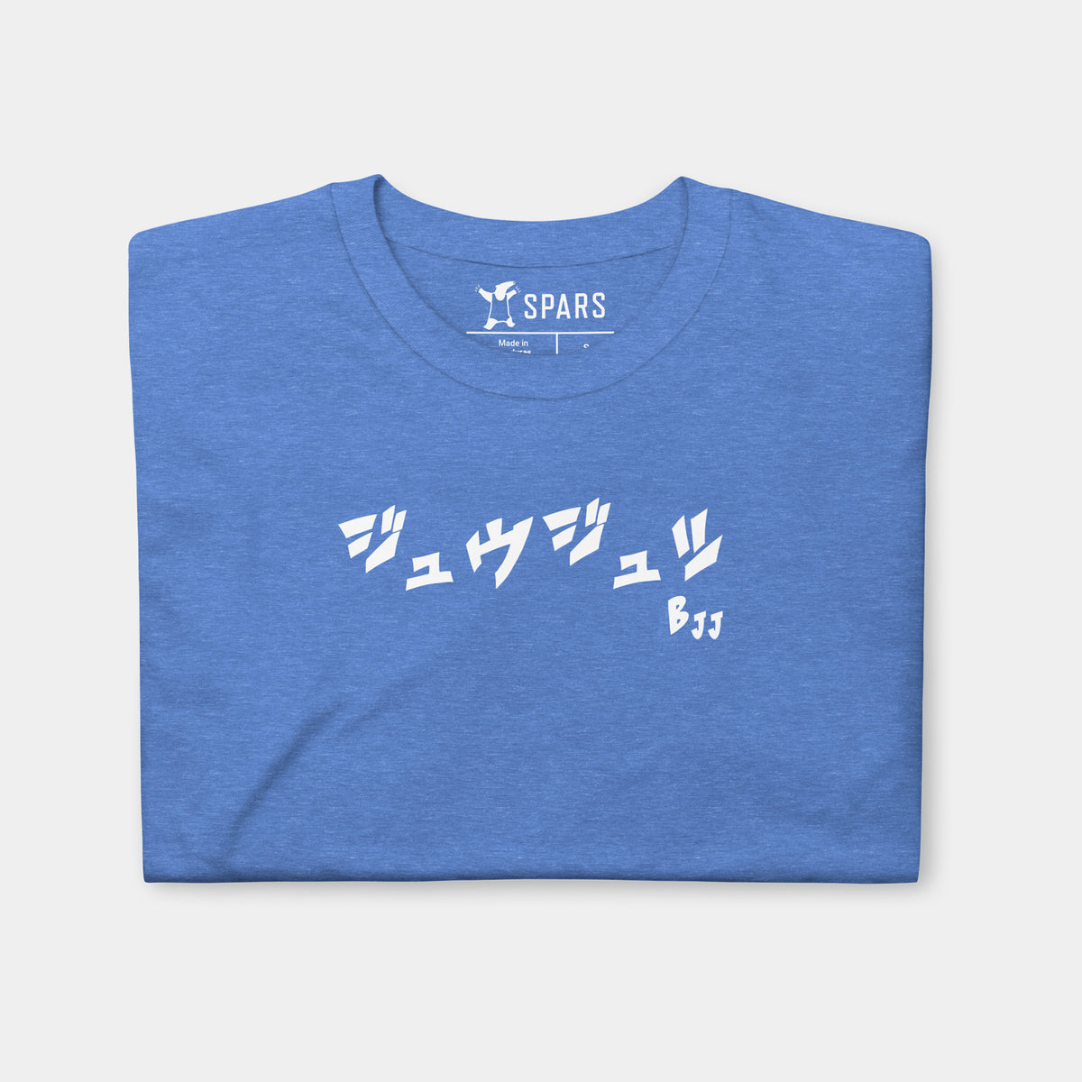 Folded Men’s BJJ KATAKANA Daily Tee in Heather Royal showing the white BJJ katakana chest design