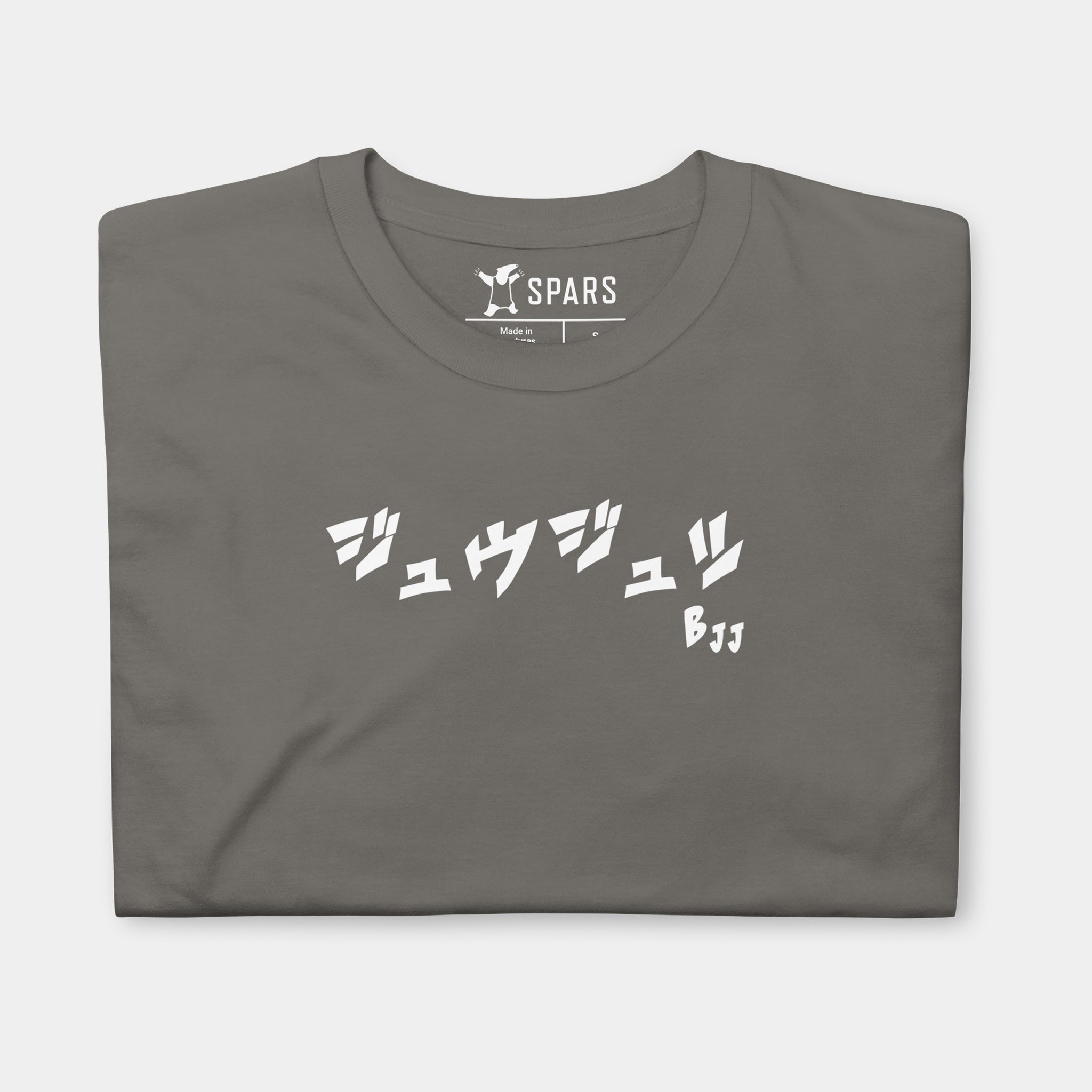 Folded Women’s BJJ KATAKANA Daily Tee in Charcoal showing the white BJJ katakana chest design