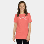 Woman wearing the Women’s BJJ KATAKANA Daily Tee in Coral Silk, front view showing the white chest print.