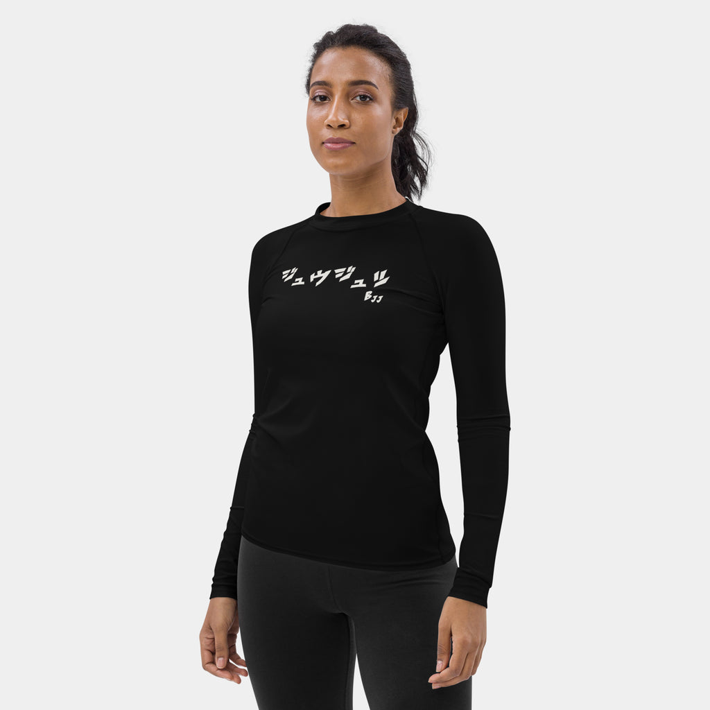 Woman wearing the Women’s BJJ KATAKANA Long-Sleeve Rash Guard in Iron Black, left three-quarter view showing the off-white chest print