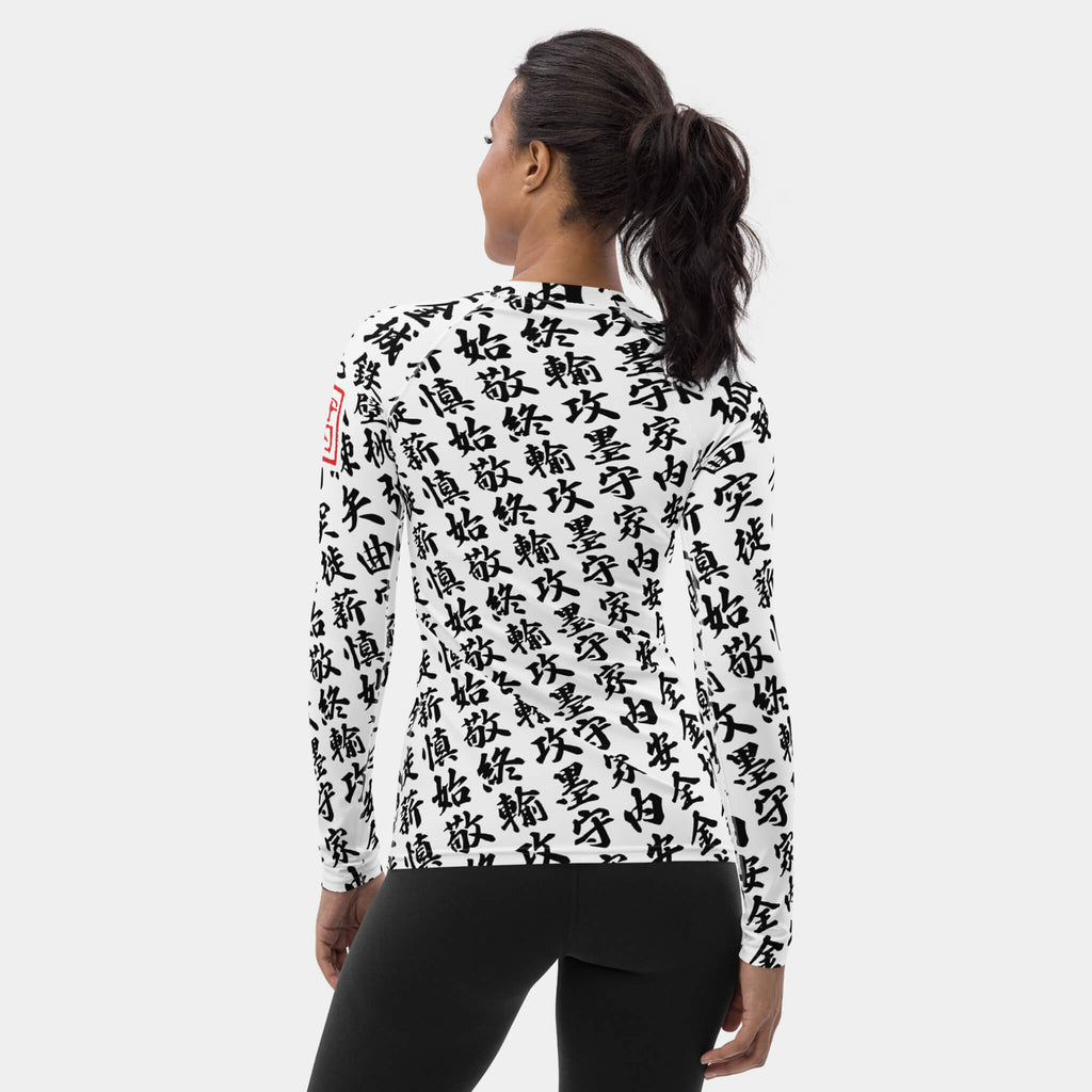 Back view of the women's TOO MUCH KANJI long-sleeve BJJ rash guard in White and Black on a model